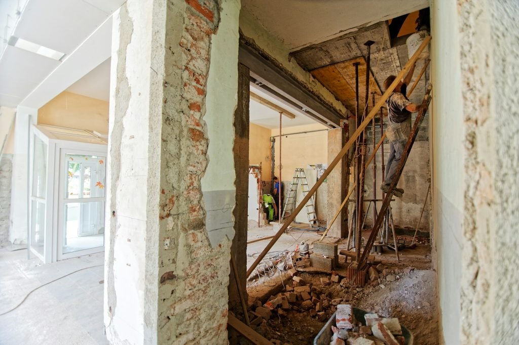 Interior of an Orange County home under renovation, with open walls and exposed framing that a home inspector can't normally see