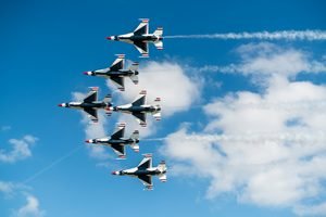 U.S. Air Force Thunderbirds flying in formation over the Huntington Beach Pier during the Pacific Air Show